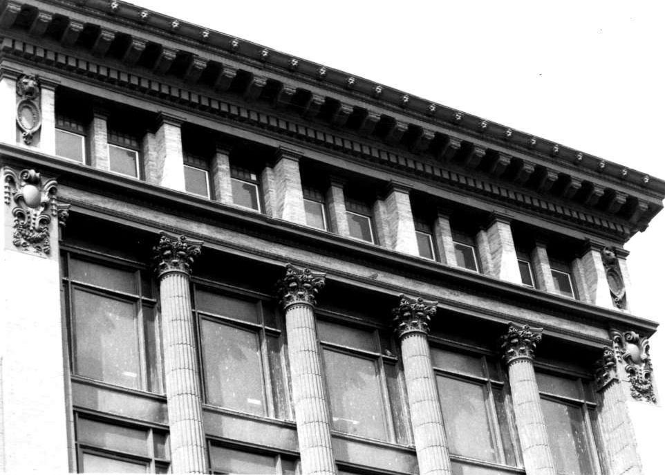 Detail of the cornice of the Gomprecht and Benesch Building, March 1986. Photograph by Janet Davis.